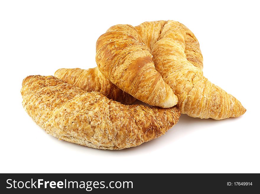 Heap of croissants isolated on white