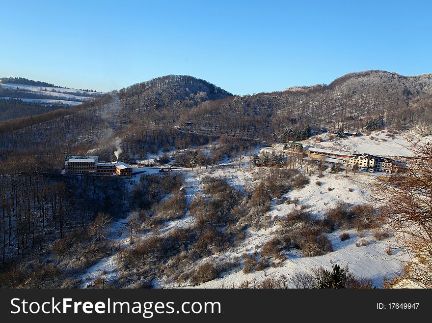 Winter mountain landscape with building. Winter mountain landscape with building