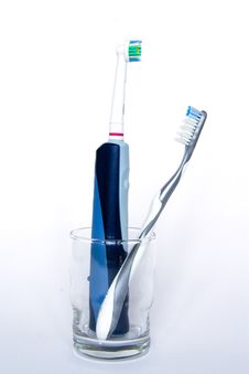 Electric And Manual Tooth-brush In A Glass Stock Photography
