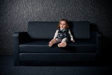 Little Girl Sitting On Sofa Stock Images Little Girl Sitting On Sofa Stock Images