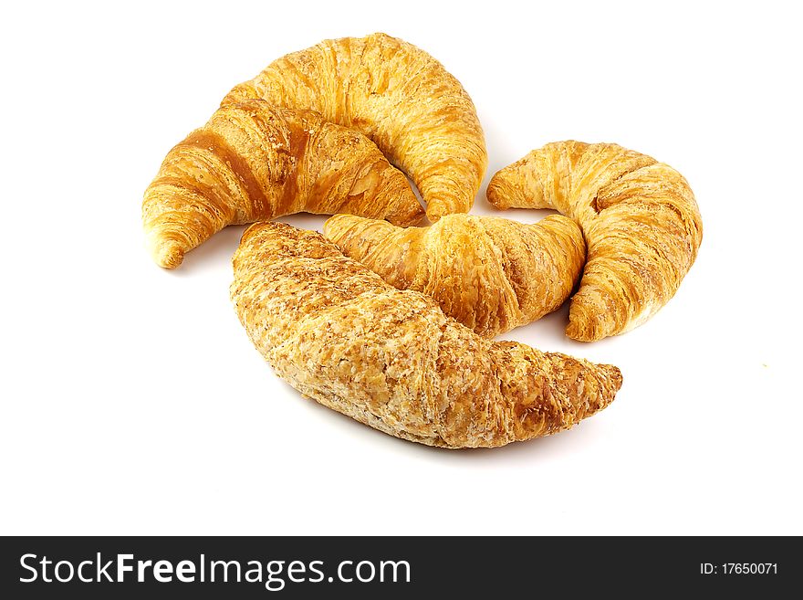 Heap of croissants isolated on white