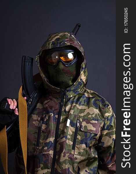 Soldier holding a machine gun AK-47. Soldier holding a machine gun AK-47