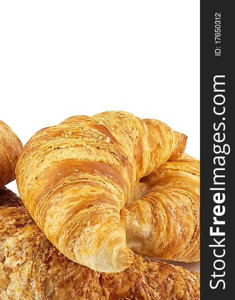 Heap of croissants isolated on white