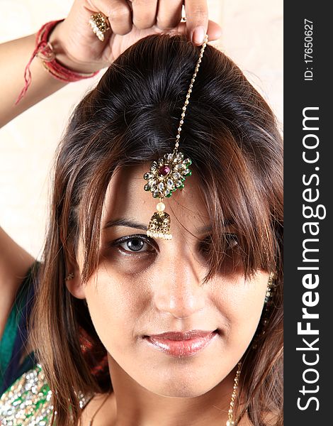 Indian girl wearing traditional kundan jewellery. Indian girl wearing traditional kundan jewellery.
