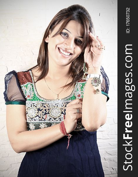 Indian girl holding traditional kundan jewellery. Indian girl holding traditional kundan jewellery.