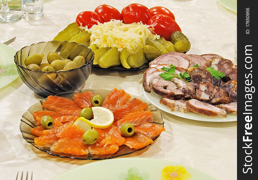 Celebratory supper with fish, meat and olives