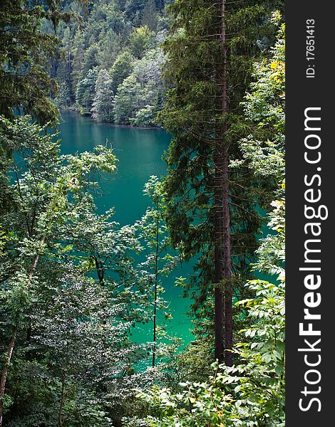 View of the lake showing the emerald blue water. View of the lake showing the emerald blue water