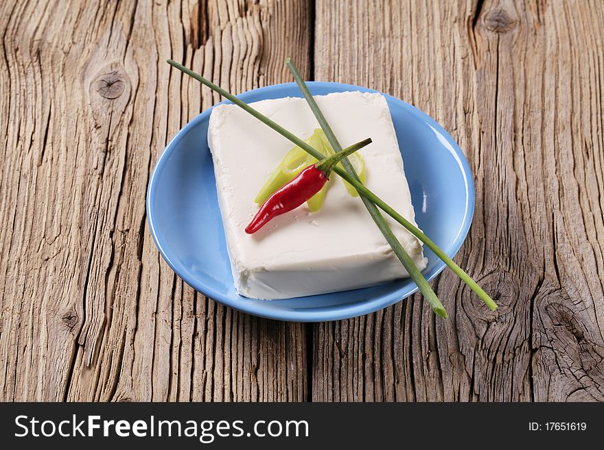 Block of fresh cheese on a plate