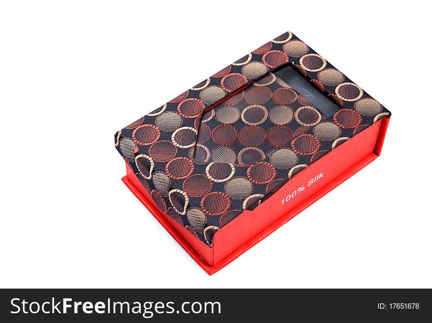 Executive silk tie in box isolated on white background.