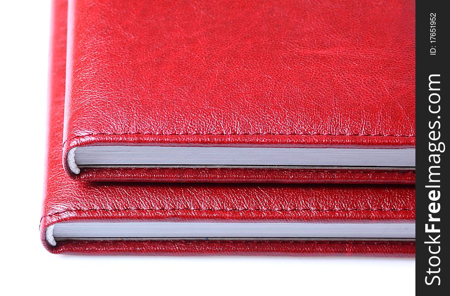 Two red books isolated over a white background.