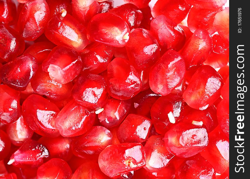 Fruit garnet isolated over white background, macro shot