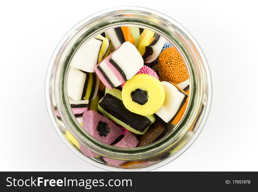 Glass bottle filled with assorted liquorice sweets candy. Glass bottle filled with assorted liquorice sweets candy