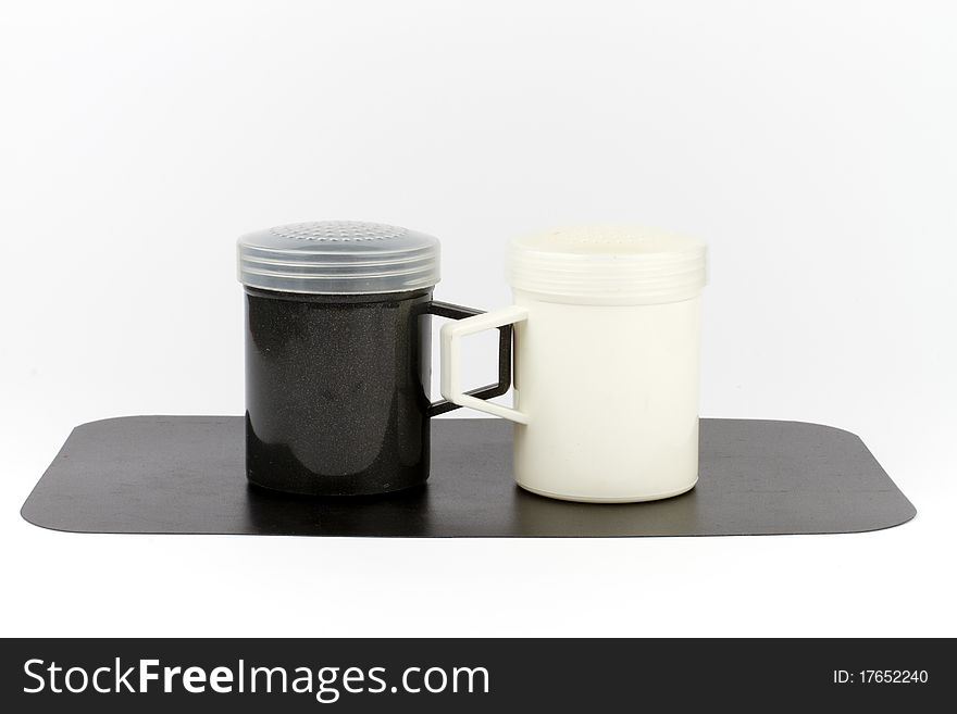 Black and white plastic salt and pepper shakers. Black and white plastic salt and pepper shakers