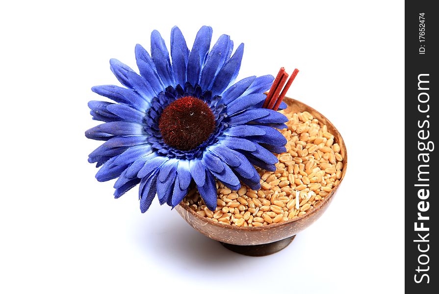 Concept shot of sacred wheat offering over white background.