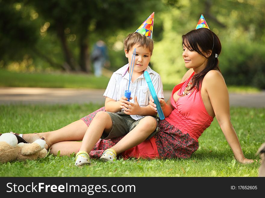 Mother and son in park on birthday. Mother and son in park on birthday
