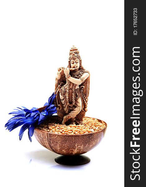 Lord krishna idol placed in wheat bowl used for worrshipping. Lord krishna idol placed in wheat bowl used for worrshipping.