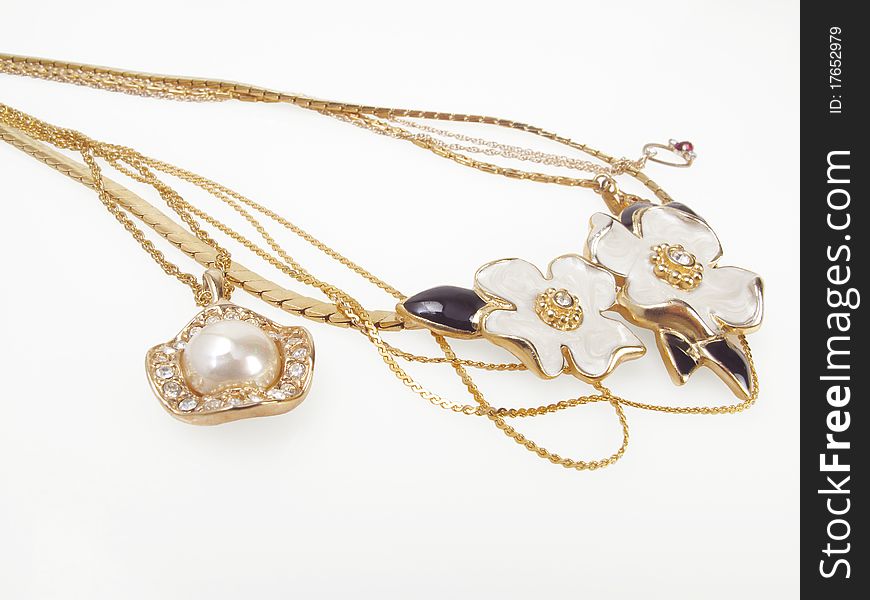 Beautiful vintage necklaces with gold chains on white. Beautiful vintage necklaces with gold chains on white