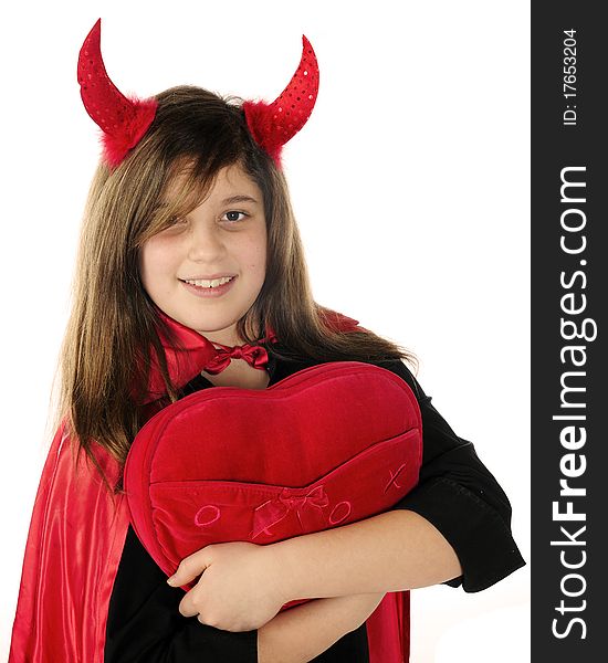 An attractive teen dressed as a devil hugging a large read heart. Isolated on white. An attractive teen dressed as a devil hugging a large read heart. Isolated on white.