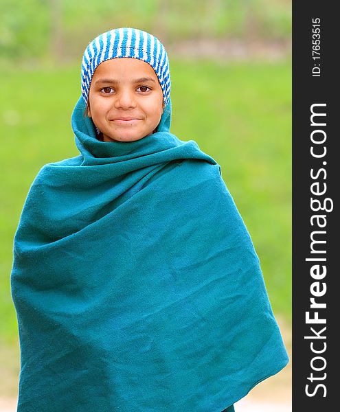 Cute muslim girl with green background.