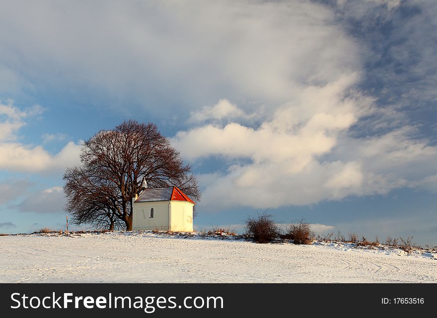 Frozen Field With A Chapel