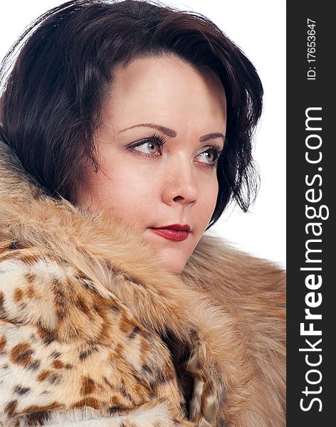 Model dressed in a fur-coat. Isolated on white background. Model dressed in a fur-coat. Isolated on white background.