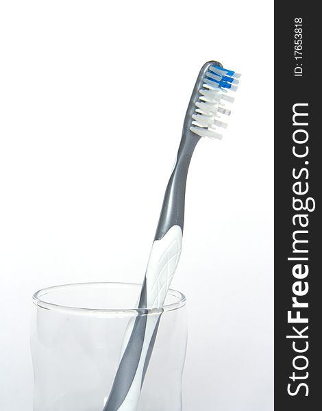 Gray tooth-brush in a glass. Gray tooth-brush in a glass