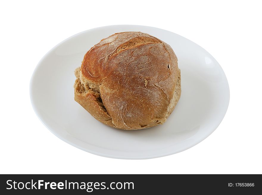 One bread on an small white plate. One bread on an small white plate