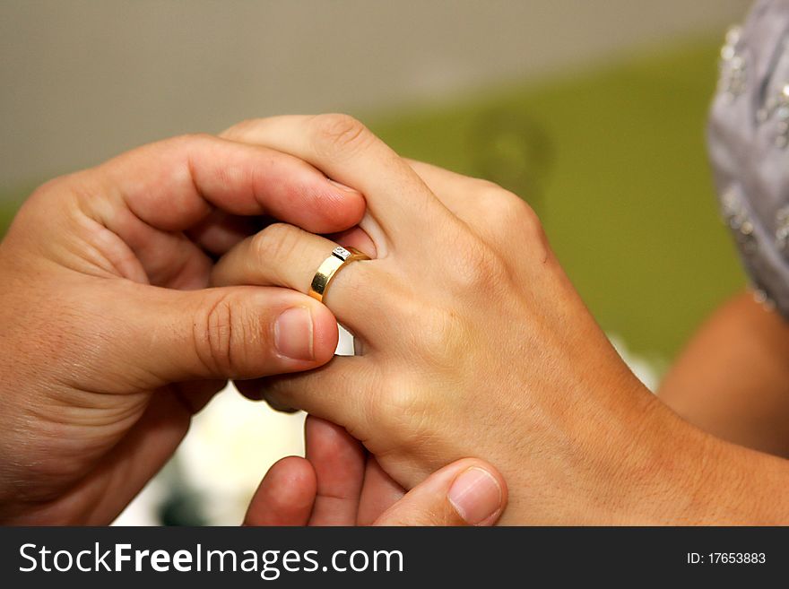 The married couple trading rings. The married couple trading rings.