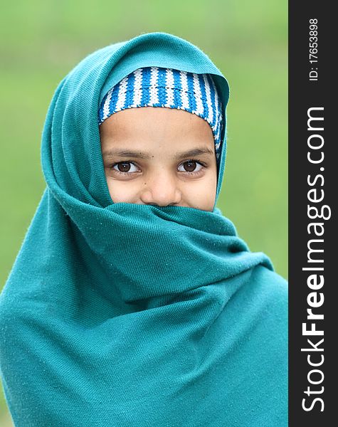 Portrait shot of shy muslim girl.