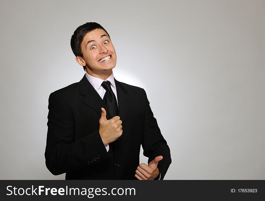 Young Serious Business Man In Black Suit