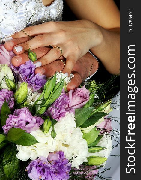 Wedding Rings Over Bouquet