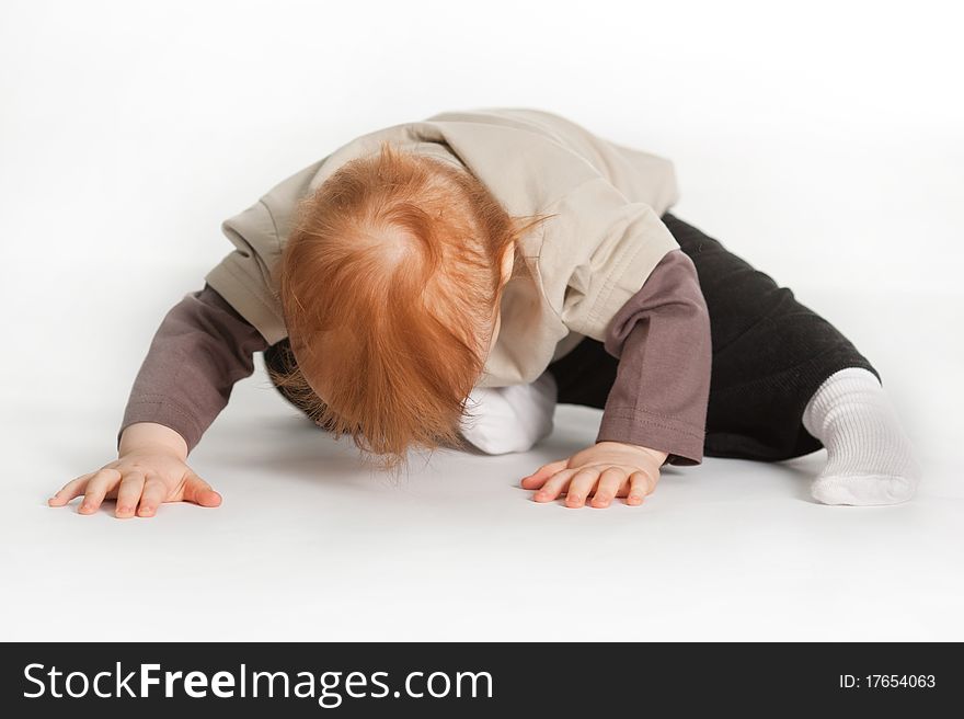 Child Laying On White Floor