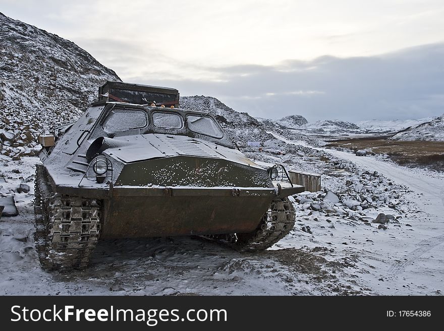 All-terrain vehicle standing in mountainous area close to Barents Sea in Kola Peninsula (Russia). All-terrain vehicle standing in mountainous area close to Barents Sea in Kola Peninsula (Russia)