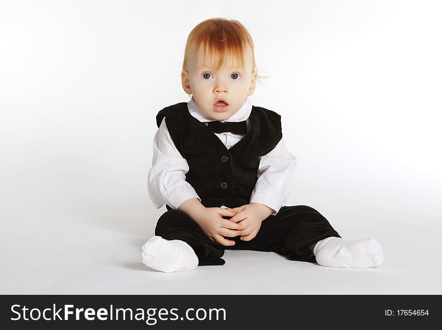 Funny boy in suit with bow