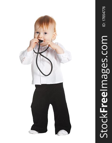 Little boy with stethoscope in mouth