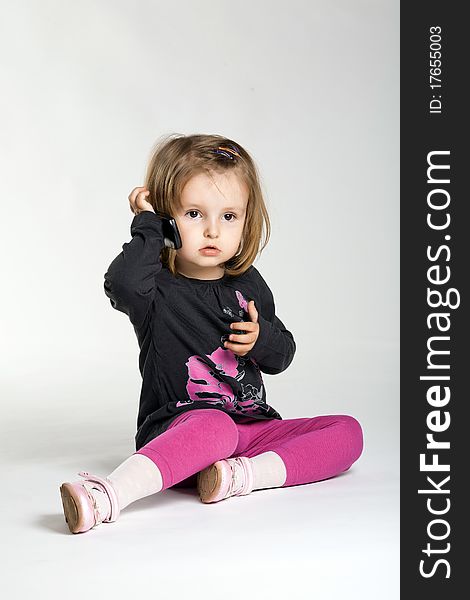 Little girl with mobile phone