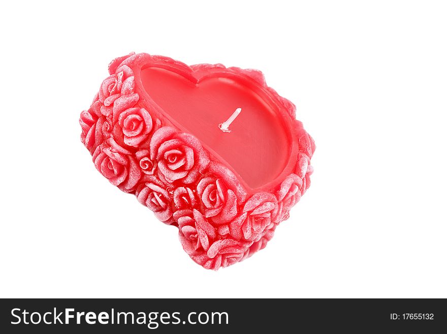 Heart-shaped candle with wax roses