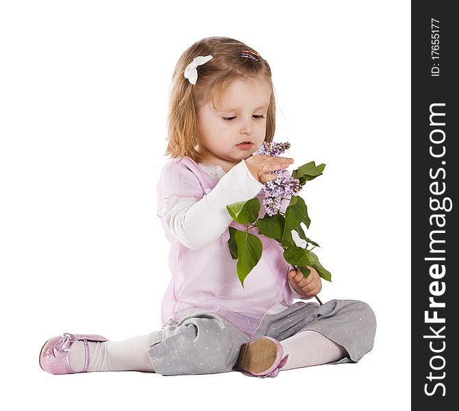 Little girl with liac flower isolated