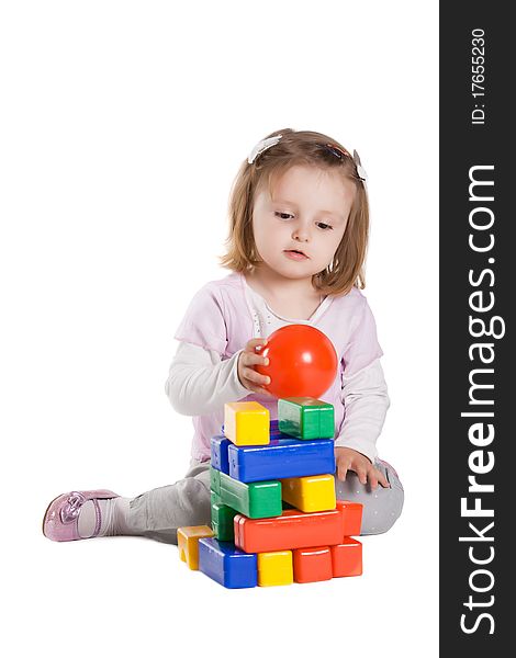 Little girl playing with cubes isolated