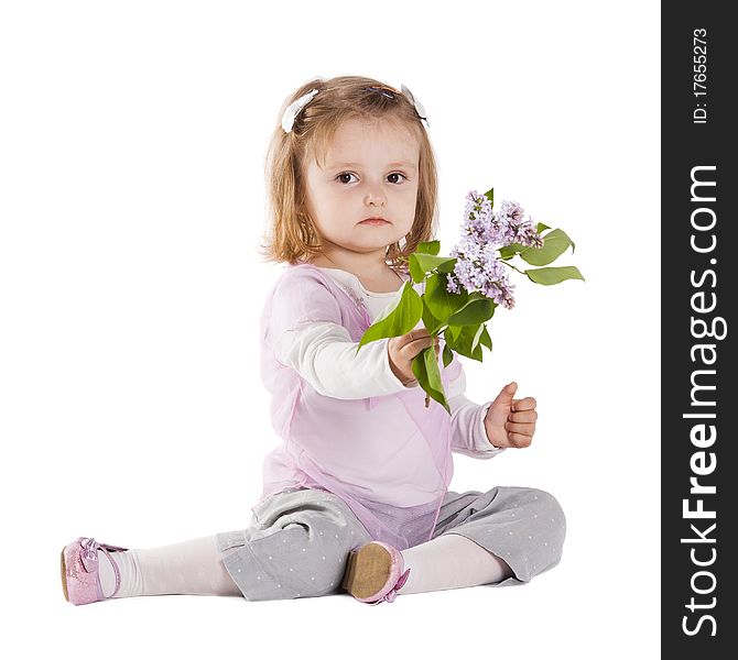 Little girl giving a branch of lilac isolated