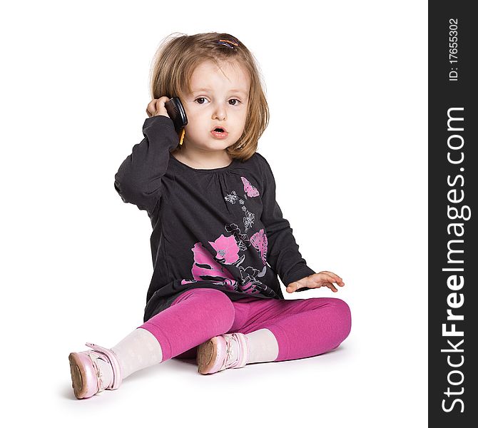 Little girl with mobile phone isolated