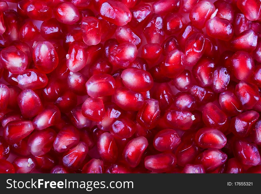 Background of pomegranate seeds full of vitamins