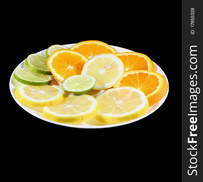 Plate of sliced citrus fruits. Plate of sliced citrus fruits
