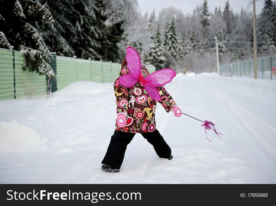 Small girl with magig wand and wings