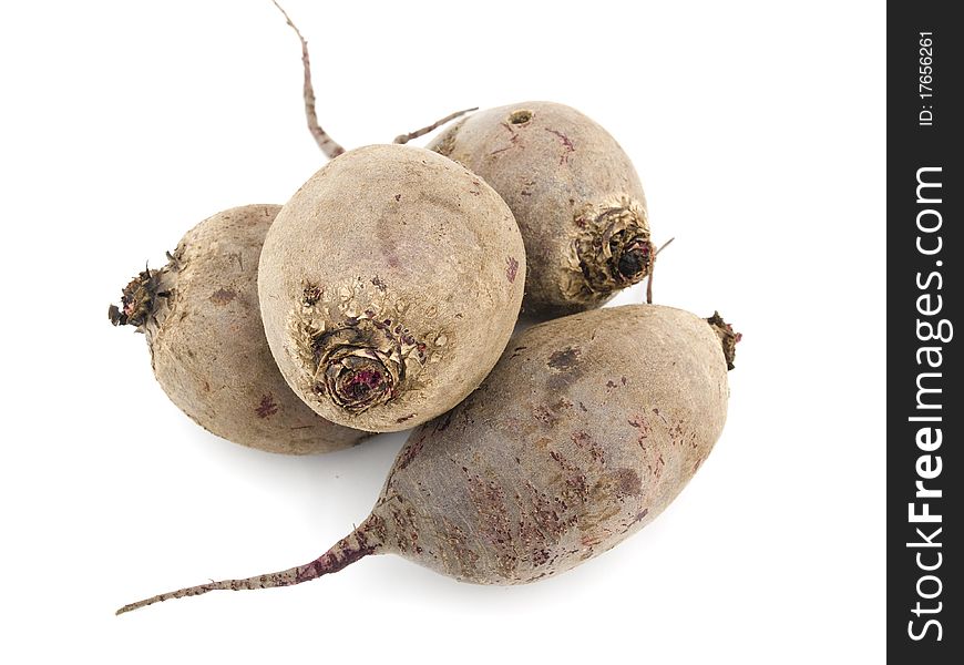 Four beets are located the friend on the friend create a heap on a white background. Four beets are located the friend on the friend create a heap on a white background