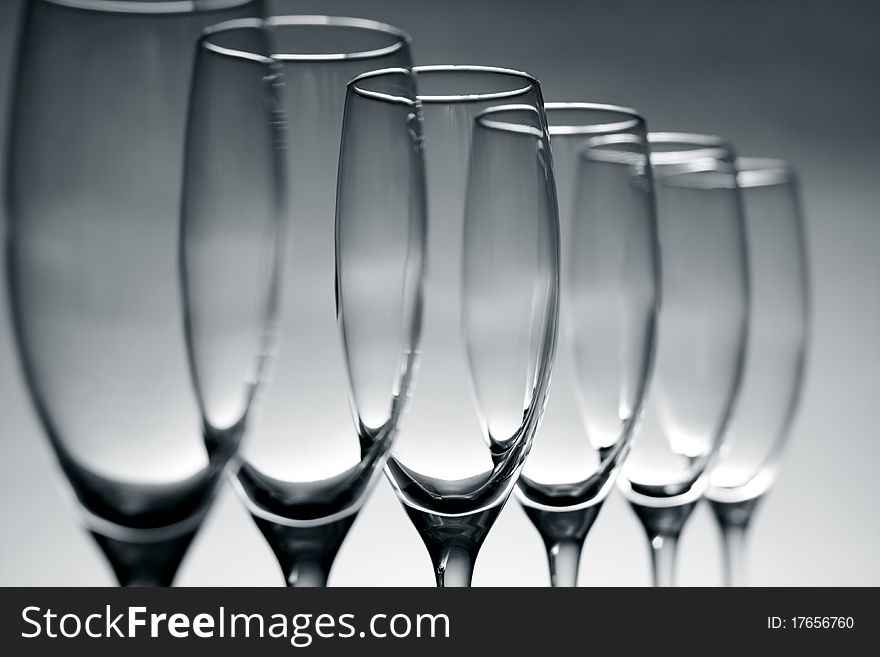 Empty champagne glasses on gray background