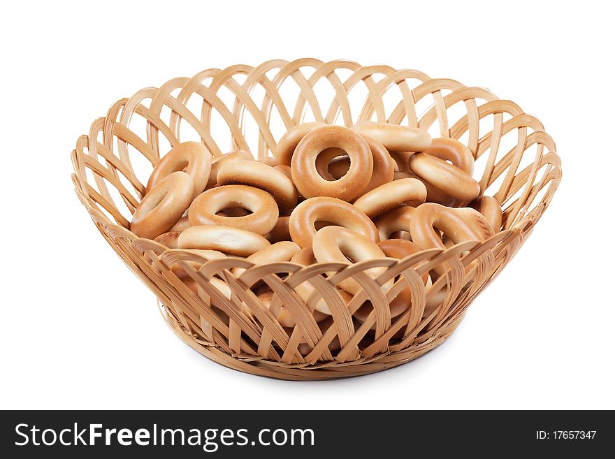 A heap of ring-shaped bread in the basket. A heap of ring-shaped bread in the basket