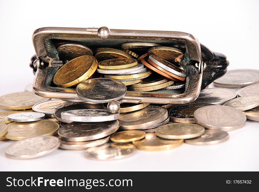 Purse with coins on white isolated background
