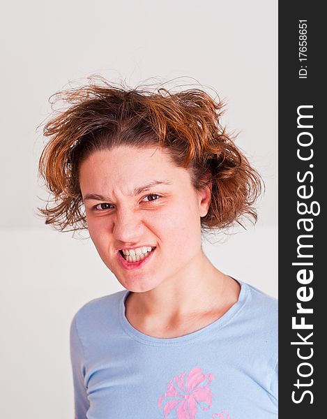 Young woman with a very angry expression on her face. Young woman with a very angry expression on her face