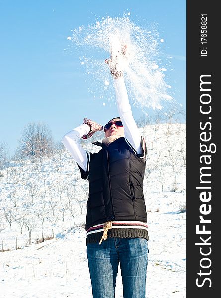 Young woman with red sunglasses in a snow fight. Young woman with red sunglasses in a snow fight